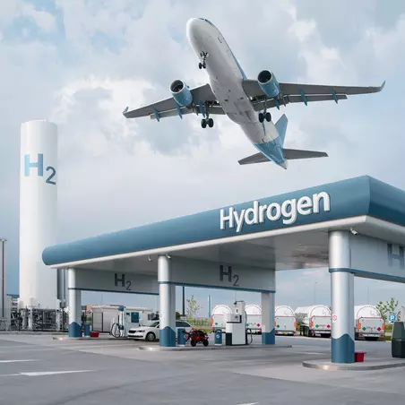 Hydrogen refueling station with a plane flying over.